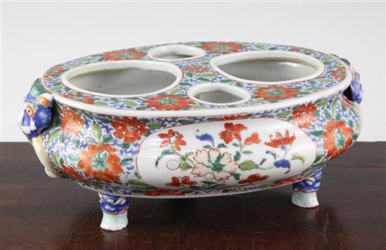 A rare and unusual Chinese Export famille verte oval desk stand, early 18th century, 25.5cm, one foot repaired